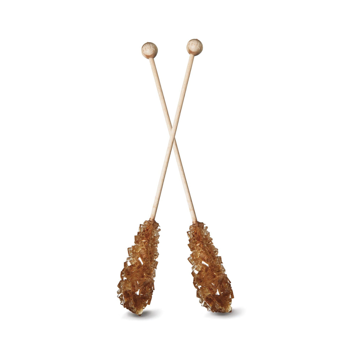 Brown rock candy sticks for sweetening tea and coffee naturally. Natural sugar crystal stirrers for hot beverages UK. Brown candy sticks dissolving in teacup at UK tea shop.