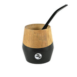 Black wooden mate cup set with metal bombilla straw for yerba mate tea.